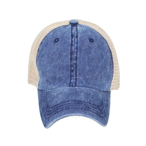 Detailed close-up of retro washed denim cotton and breathable mesh trucker cap design