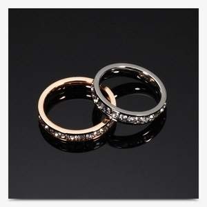 Detail view of 4mm rose gold and silver stainless steel rings with full crystal inlay
