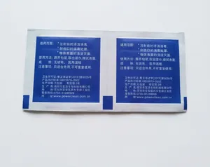 Macro detail of two individual blue medical alcohol prep pads for skin sterilization