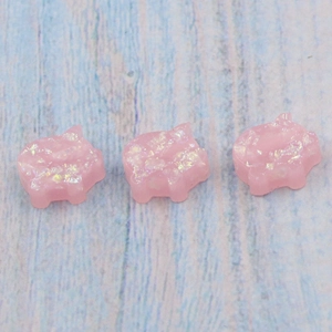 Pink synthetic opal pig shaped beads with shimmering finish for DIY jewelry crafts
