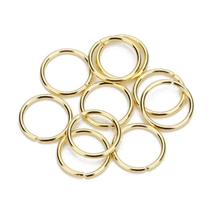 Close-up of golden stainless steel open jump rings for DIY jewelry making accessories