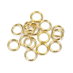 Close-up of golden stainless steel jump rings for DIY jewelry making and connection