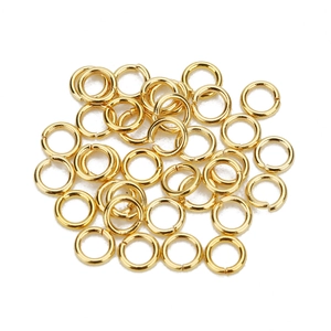 Detailed view of golden stainless steel open jump rings for DIY jewelry making crafts