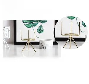 Detail of gold iron flower stand featuring durable plating and a sturdy tripod structure