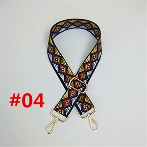 Detail of bohemian woven strap with golden lobster clasps and diamond patterns