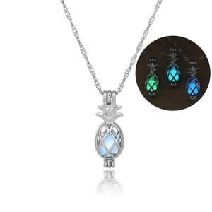 Glow-in-the-dark pineapple cage necklace with luminous beads in green and blue colors