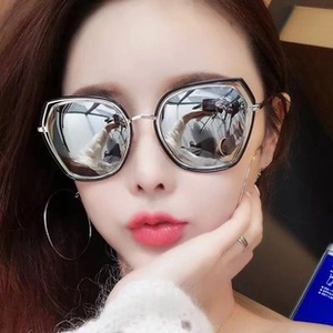 Close-up of geometric square sunglasses with silver mirrored lenses and double-rim frame