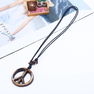 Vintage handmade woven necklace with brown and white resin peace sign pendant