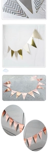 Detail of Nordic wavy gold foil triangle banners in metallic gold, silver and rose gold finishes