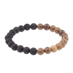 Macro detail of elastic bead bracelet with black lava rock and wood grain beads