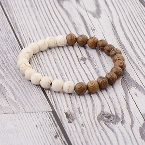 Detailed view of handmade beaded bracelet with white turquoise and brown wood grain beads