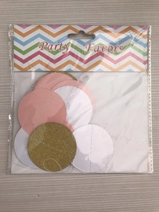 Detail of pink, white, and gold glitter round paper confetti for party decorations