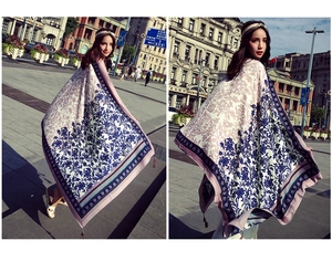 Detail view of ethnic floral print scarf with tassels and bohemian patterns