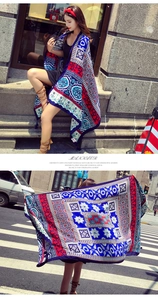 Detail view of Bohemian floral pattern with fringed edges on a summer cotton linen shawl