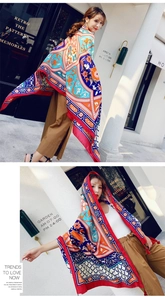 Detail of bohemian floral pattern on large summer shawl with vibrant exotic prints