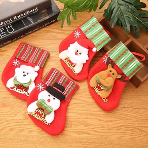 Set of four red plush Christmas stockings with Santa, snowman, bear and reindeer designs