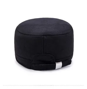Back view of black flat top cap showing adjustable silver metal buckle and neat stitching