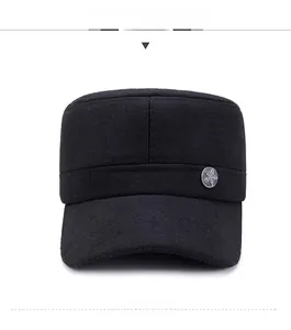 Front view of black flat top military hat with silver five-star metal badge detail