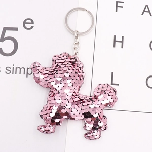 Close-up of pink reversible sequin poodle keychain with shiny metallic ring and chain