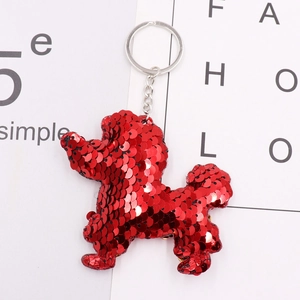 Close-up of red sequined poodle keychain featuring reflective texture and silver ring