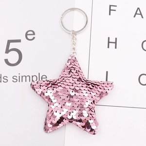 Pink star-shaped sequin keychain with reflective glitter and silver metal ring
