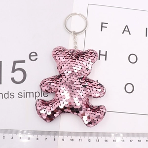 Close-up of pink sequin star bear keychain with metal ring and 12cm ruler scale detail
