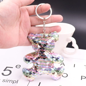 Detailed view of a handmade colorful sequin star keychain with reflective texture