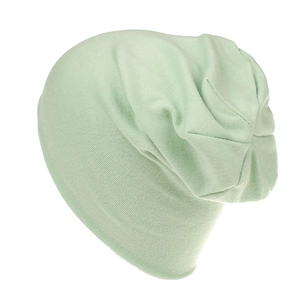 Detailed knit texture of a mint green slouchy beanie for children made of soft cotton