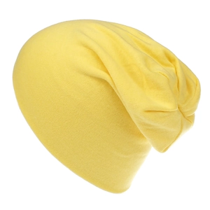 Detailed close-up of the bright yellow cotton knit beanie with soft ribbed texture