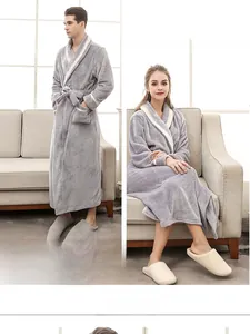 Detailed view of plush thick bathrobe with white piping on collar and sleeves
