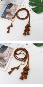 Close-up of brown braided waist belt featuring gold ring buckle and leather-style tassels