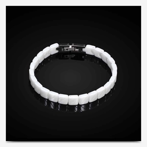 Detail view of 7mm white ceramic bracelet showing stainless steel clasp with hallmarks