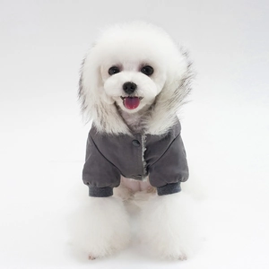 Detail of dog winter jacket featuring plush faux fur collar and ribbed cuffs for warmth