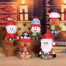 Close-up of Christmas candy jars with 3D Santa, Snowman, and Reindeer characters
