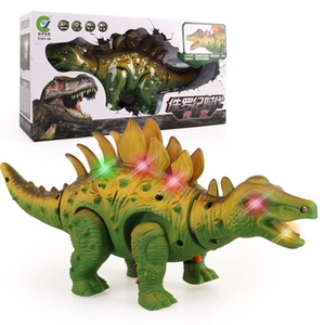 Macro shot of green stegosaurus dinosaur toy with LED lights on back and eyes