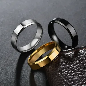 Polished silver, black and gold stainless steel rings with beveled edges on leather