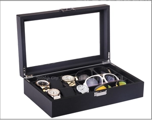 Detail view of carbon fiber storage box with 6 watch slots and 3 sunglass sections