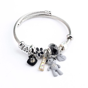 Adjustable stainless steel wire bracelet with silver bear and heart charms