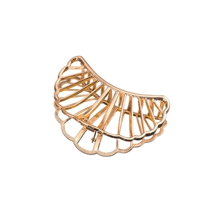 Minimalist large hollow shell-shaped gold metal hair claw clip with wave texture