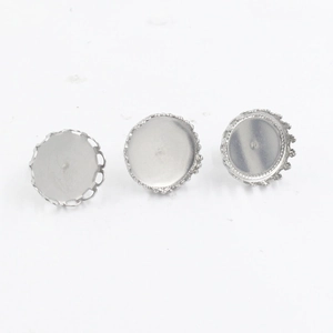 Detailed view of silver crown-edge stainless steel earring studs in three perspectives