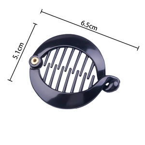 Detail view of round black plastic banana hair clip with internal teeth and size dimensions