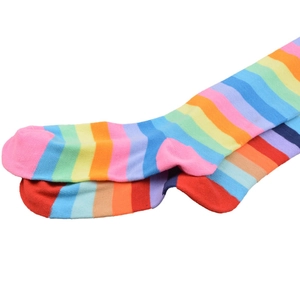Detailed close-up of rainbow striped cotton blend knee-high socks featuring vibrant colors