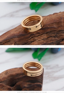 Detailed view of polished gold titanium steel ring featuring black engraved male symbol