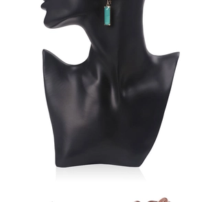 Detailed view of rectangle green gemstone pendant on black bust display stand