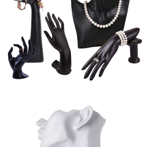 Detailed set of black hand and neck busts with white ear models for jewelry display