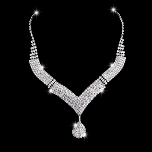 Close-up of a silver V-shaped rhinestone bridal necklace with a water drop pendant
