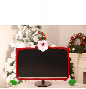 Detailed view of a 3D Santa Claus computer monitor cover made of red festive fabric