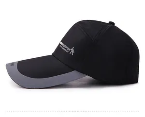 Side view of black outdoor baseball cap featuring breathable fabric and grey brim trim