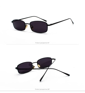 Detalle de gafas de sol rectangulares con montura fina de metal negro y almohadillas