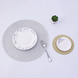 Nordic round metallic woven placemat set with elegant silver and gold heat resistant pads